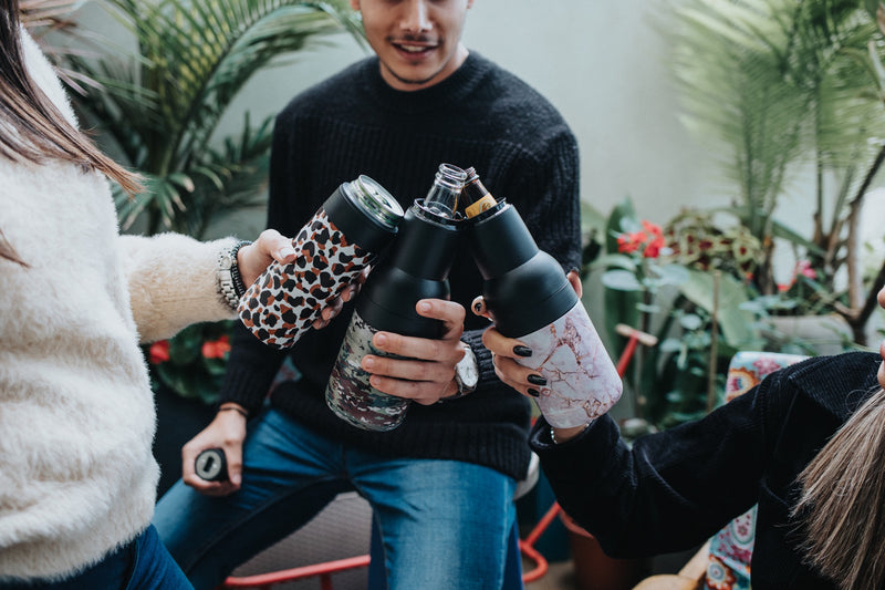 Friends celebrating with Asobu bottle coolers